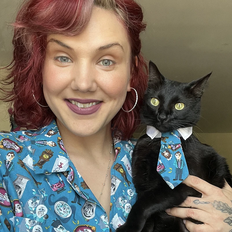 woman holding cat with matching outfit